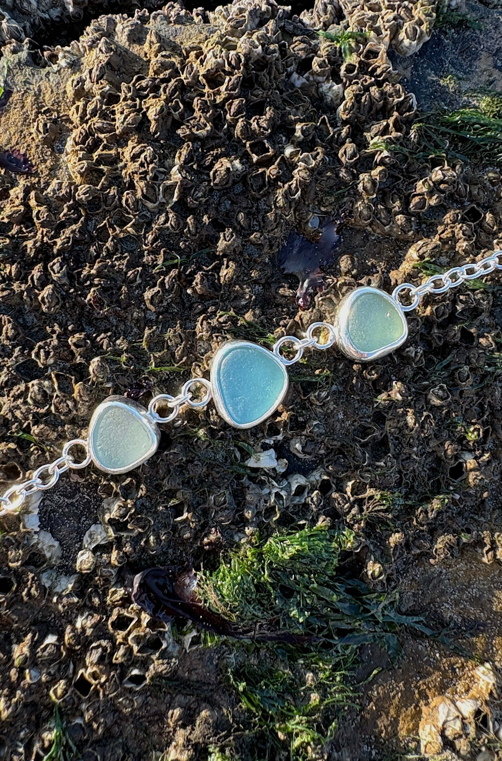 sterling silver bracelet with three pieces of seaglass 