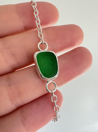 Green sea glass pendant on a sterling silver chain